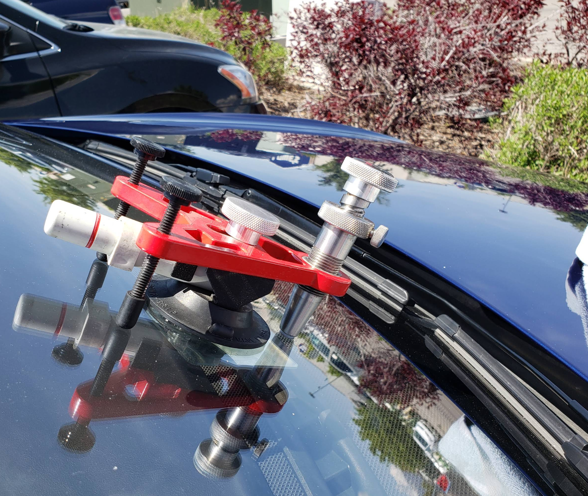 Rock chip repair tool on windshield